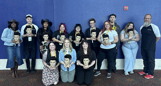 Students and instructors after a hands-on haircutting class with American Crew